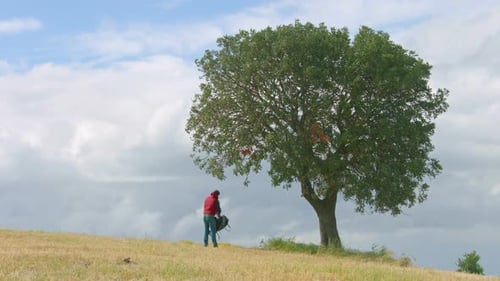 Backpacker Having Rest Under Green Tree, Active Lifestyle, Tourism, Vacation