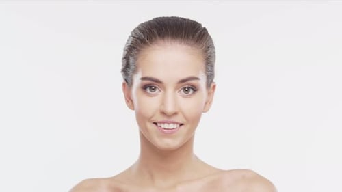 Beautiful Young Woman Smiling on White Background