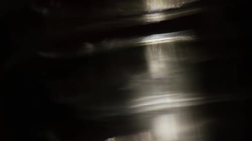 Abstract Light Effects Shimmering on Dark Background