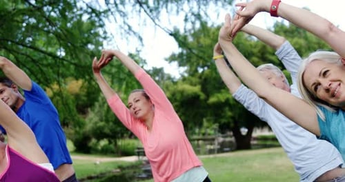 Group of people exercising together in the park