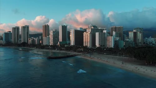Aerial drone footage of Honolulu, Hawaii.
Beautiful real estate, buildings in the city.
Palm trees