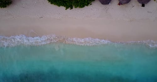Luxury overhead abstract shot of a summer white paradise sand beach and aqua turquoise water