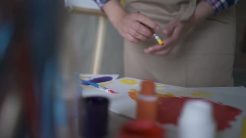 Close Up of Artist Painting with Colorful Paints