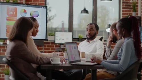 Diverse Team Collaborating in Office Meeting