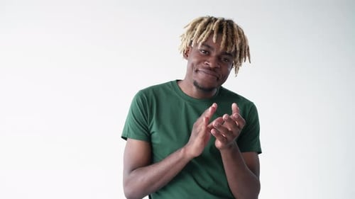 Young Adult Male With Blond Dreads Clapping Hands