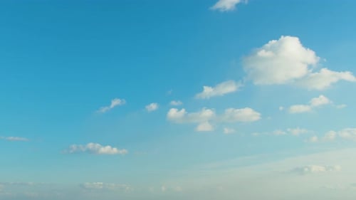 Blue Sky with White Clouds Floating Calmly