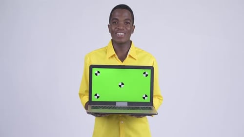 Young Adult Holding Laptop with Green Screen