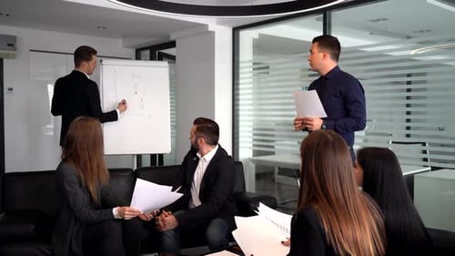 Young Businessman at the Office Presentation