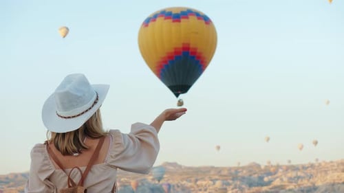 Woman Admiring Hot Air Balloons in Cappadocia