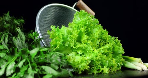 Fresh Green Vegetables with Metal Colander Close Up