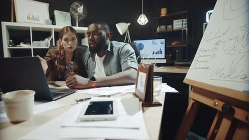 Focused Businesswoman Looking for Solution on Laptop Screen in Hipster Office.