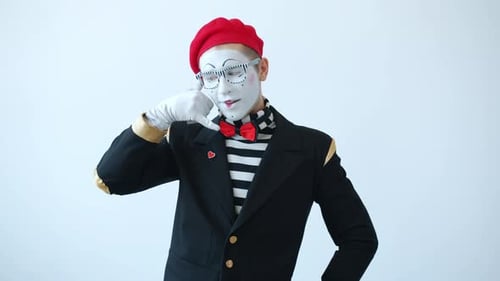 Mime Artist Making Call Me Gesture