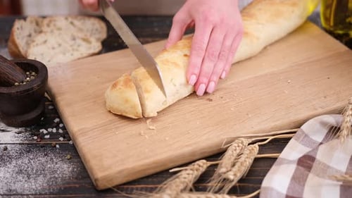 Baguette Sliced on Cutting Board