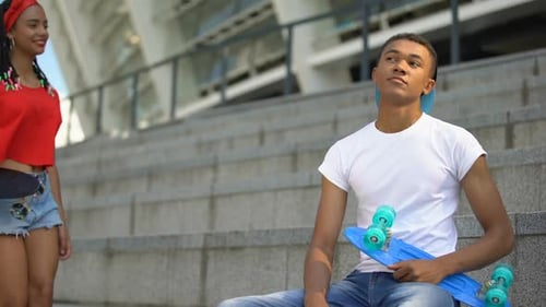 Cute Mixed-Race Girl With Skateboard Sitting Near Guy, Common Interests, Hobby