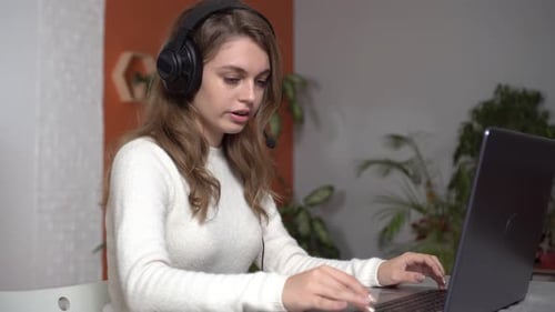 Woman Works in the Telephone Support Service