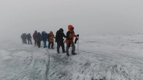 Mountaineering activity on the steep mountain slope