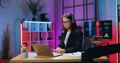 Young Woman on Video Call in Modern Office