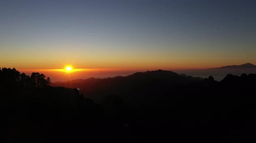 Majestic Mountains Meet Radiant Sunrise in Nature