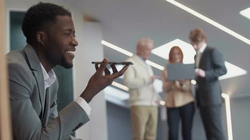 Man Using Voice Command in an Office