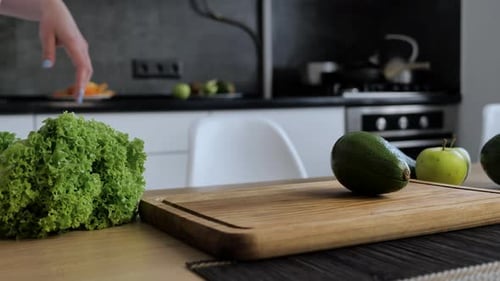 Cutting Fresh Avocado for a Healthy Kitchen Meal