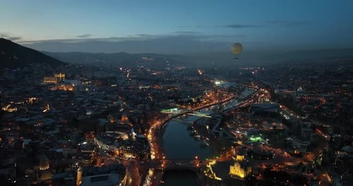Aerial view of Tbilisi city central park and Bridge of Peace. Beautiful cityscape of old Tbilisi