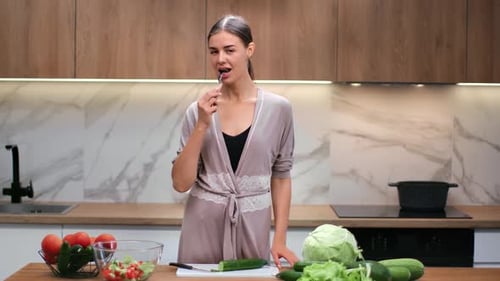 Woman Making Healthy Salad in Modern Kitchen
