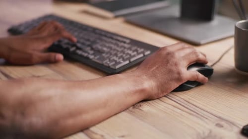 Close Up of Hands Typing on Computer