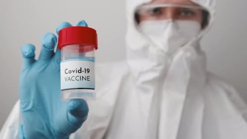 Medical Worker Holding Covid-19 Vaccine Vial