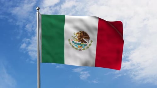 Waving Mexican Flag Against Blue Sky with Clouds