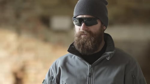 Bearded Man Communicates on Walkie Talkie