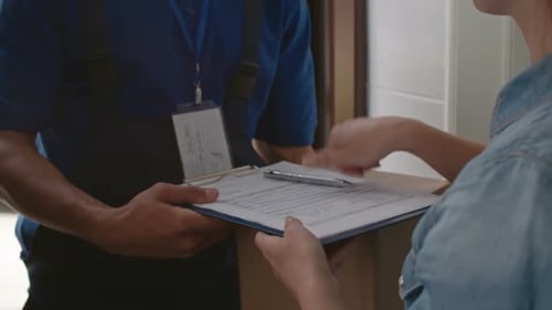 Package Delivery Driver Delivers to Residential Home
