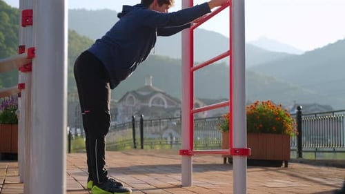 Man Stretching Outdoor on Sunny Day for Fitness