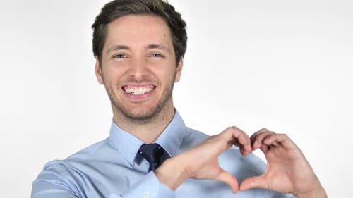 Happy Man Makes Heart Shape with His Hands