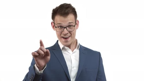 Smiling Man Pointing at the Camera on White