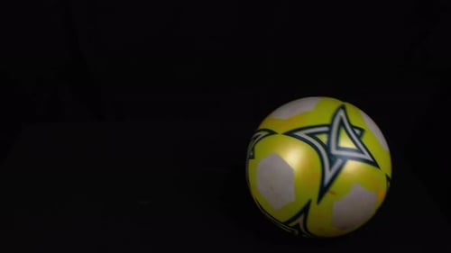 Rotating Soccer Ball Close Up on Black