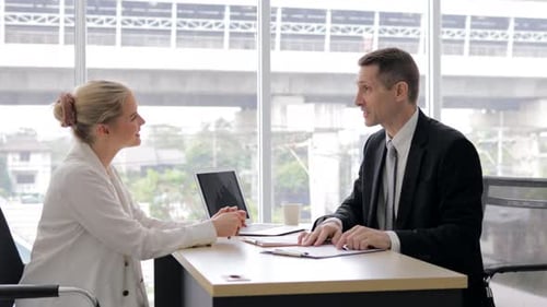 Business Meeting and Handshake in Modern Office