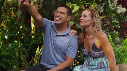 Couple looking watching monkeys in tropical jungle, Costa Rica. Shot on RED EPIC for high quality 4K