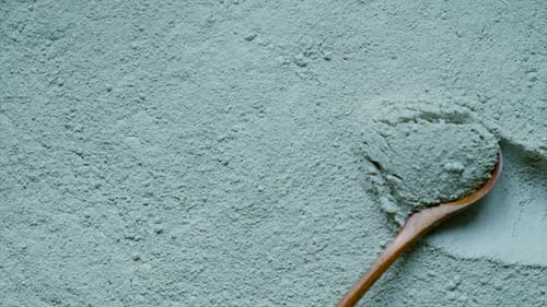 Blue Clay Powder Being Moved With Spoon