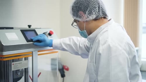Male Pharmacist is in Work Process with Modern Equipment in Pharmaceutical Factory Spbd