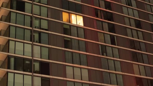 High Rise Building Windows, One Lit at Night