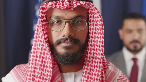 Man Wearing Keffiyeh Looking at Camera