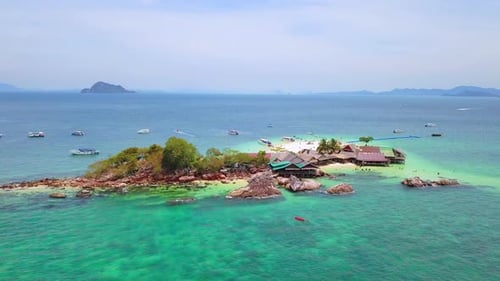 Aerial view of beach at Koh Khai, a small island, with crowd of people, tourists