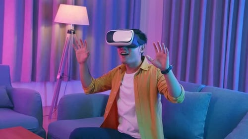 Young Adult Experiencing Virtual Reality Gaming at Home