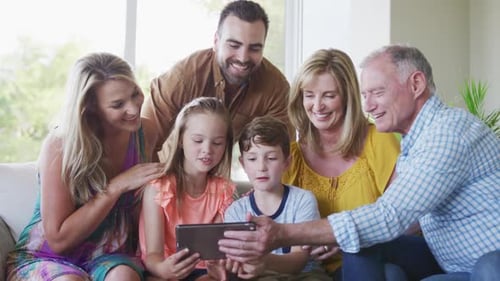 Family Group Enjoys Tablet Device Together