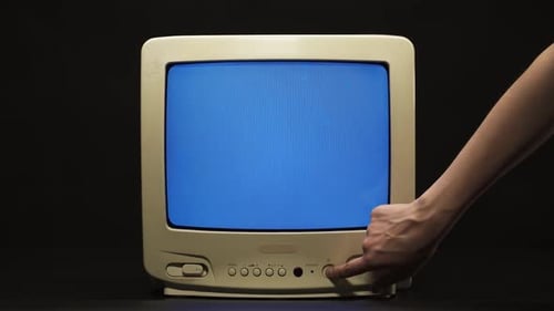 Turning Off Old Retro Square Television with Blue Screen on Black Background
