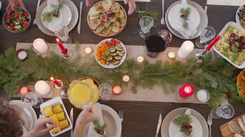 Top View of People Setting Table on Christmas