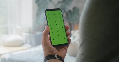 Man Holding a Smartphone