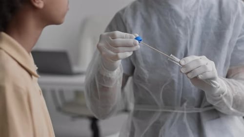 Unrecognizable Doctor Taking Sample for Analysis
