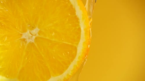 Bright Orange Slice with Cascading Water