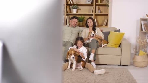 Loving Family and Dogs Relaxing Together at Home